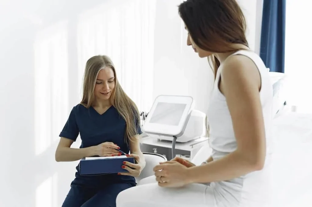 Nurse talking with a patient in a bright clinic