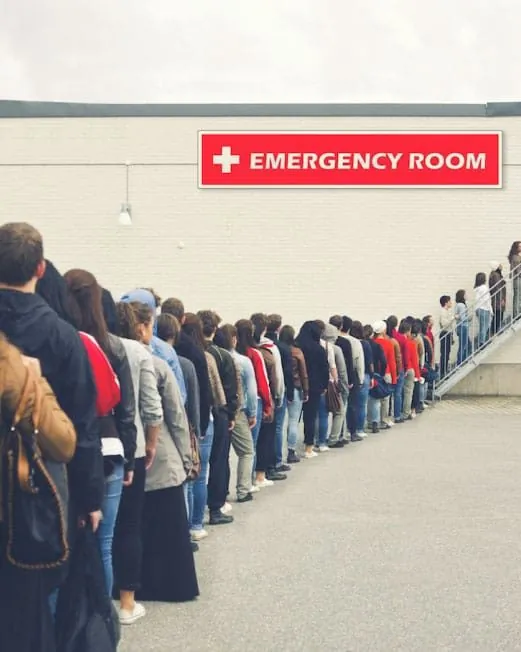 Long queue of people waiting outside an emergency room