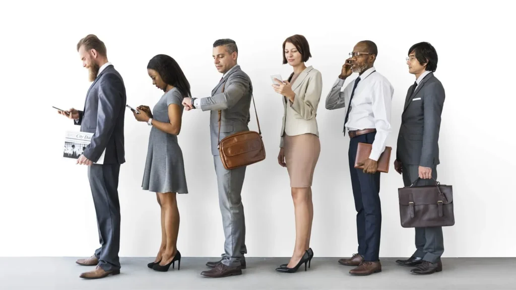 Customers standing in a single line, waiting to be called