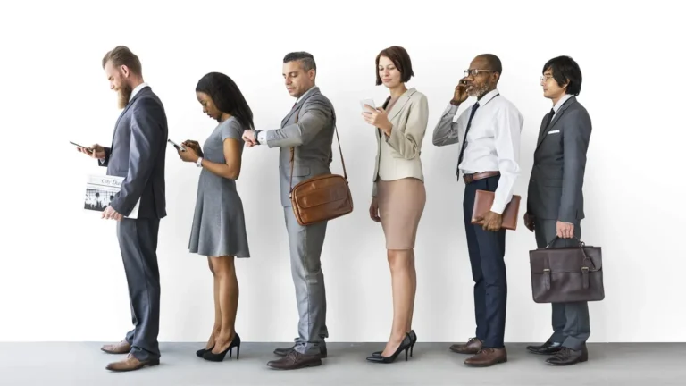 Customers standing in a single line, waiting to be called