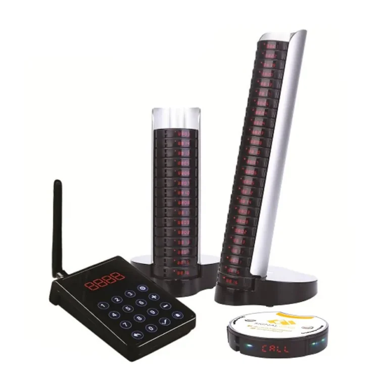 Series Mini S pagers on the tower charger beside the keypad transmitter