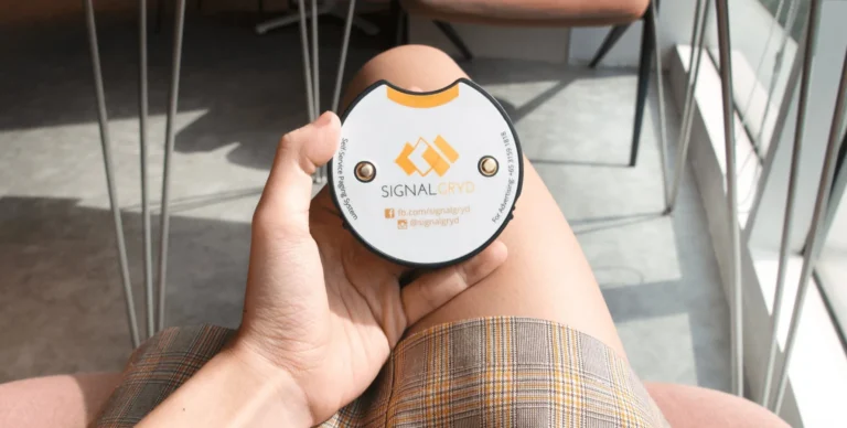 Hand holding a Series Mini S pager