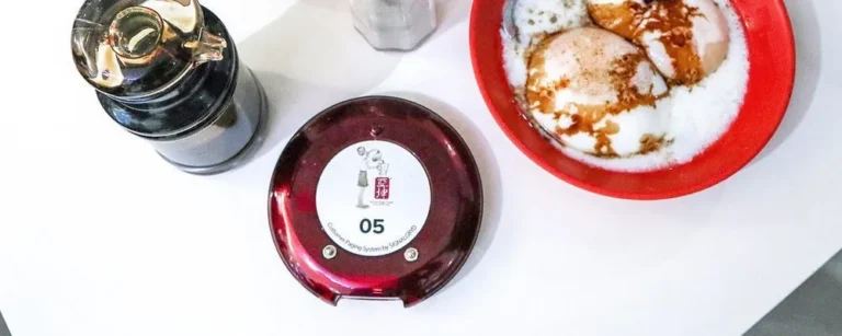 Series Modern pager on a restaurant table beside a meal