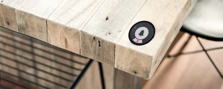 Black Series Primary call button on the corner of a table