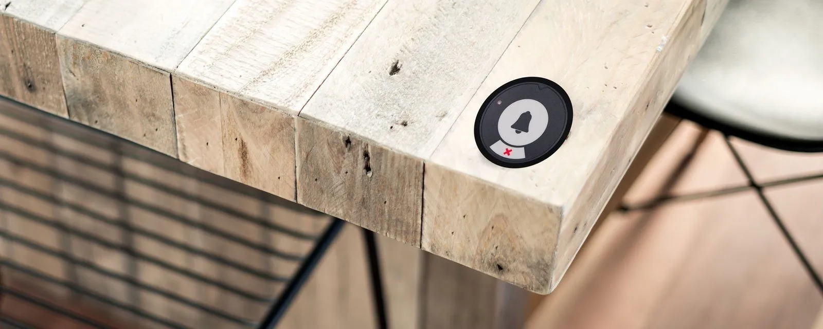 Black Series Primary call button on the corner of a table