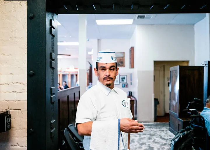 Chef standing at a kitchen doorway