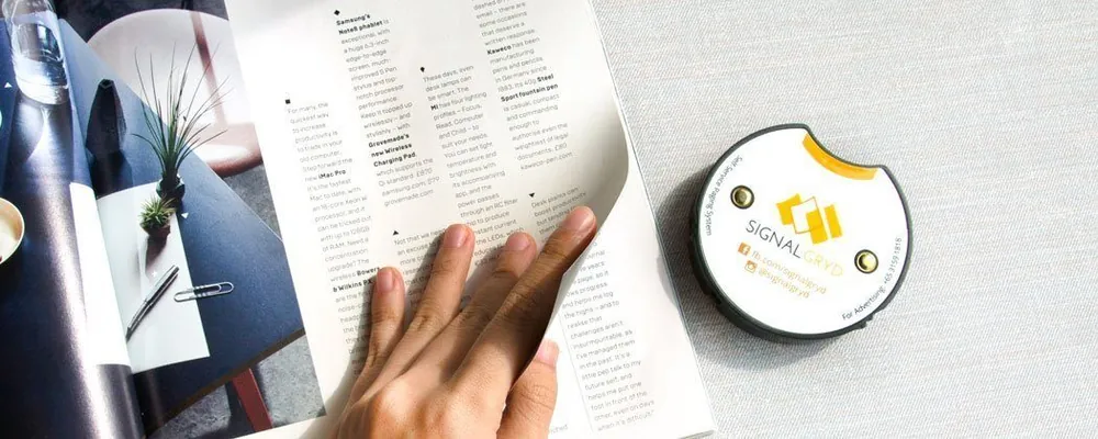 Series Mini S pager beside an open magazine
